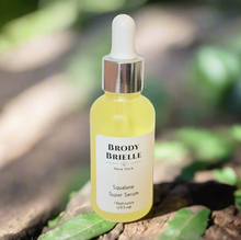 Load image into Gallery viewer, Bottle of Brody Brielle Squalane Super Glow Serum on a natural background