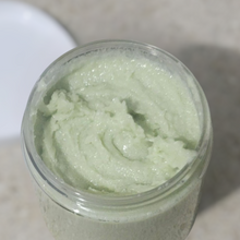 Load image into Gallery viewer, Open jar of green Brody Brielle Green Tea + Cucumber Shea Sugar Scrub on a marble surface