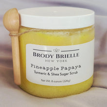 Load image into Gallery viewer, Jar of Pineapple Papaya Turmeric &amp; Shea Sugar Scrub by Brody Brielle New York on a neutral background with wooden scoop spoon
